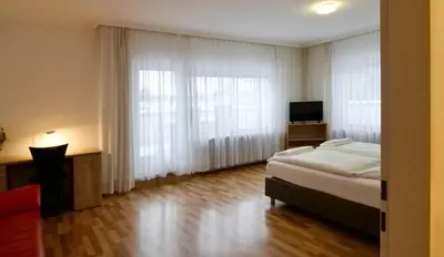 Ein Bett oder Betten in einem Zimmer der Unterkunft Hotel Pegasus