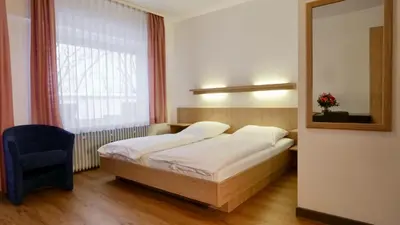 Ein Bett oder Betten in einem Zimmer der Unterkunft Hotel Pegasus