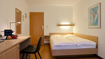 Ein Bett oder Betten in einem Zimmer der Unterkunft Hotel Pegasus
