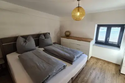 Ein Bett oder Betten in einem Zimmer der Unterkunft Chaletwohnung vor den Toren des Chiemgaus