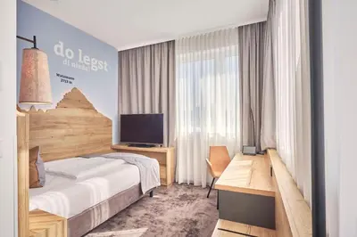 Ein Bett oder Betten in einem Zimmer der Unterkunft Best Western Hotel Arabellapark Muenchen