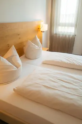 Ein Bett oder Betten in einem Zimmer der Unterkunft Hotel Poellners 20 min von München Hbf