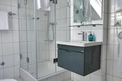 Ein Badezimmer in der Unterkunft Hasi's Hotel