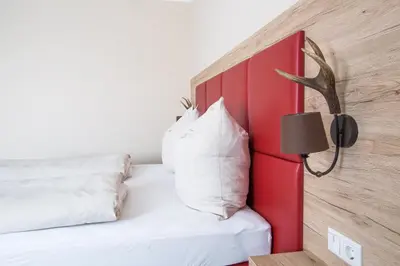 Ein Bett oder Betten in einem Zimmer der Unterkunft Aparthotel Altomünster - Garni