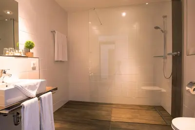 Ein Badezimmer in der Unterkunft Aparthotel Altomünster - Garni