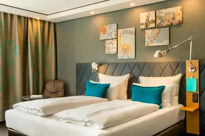 Ein Bett oder Betten in einem Zimmer der Unterkunft Motel One München-Westend
