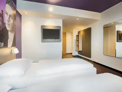 Ein Bett oder Betten in einem Zimmer der Unterkunft B&B Hotel Augsburg-West