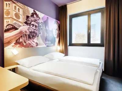 Ein Bett oder Betten in einem Zimmer der Unterkunft B&B Hotel Augsburg-West