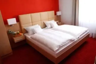 Ein Bett oder Betten in einem Zimmer der Unterkunft Hotel-Gasthof-Kohlmeier