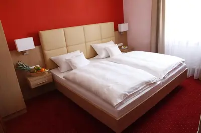 Ein Bett oder Betten in einem Zimmer der Unterkunft Hotel-Gasthof-Kohlmeier