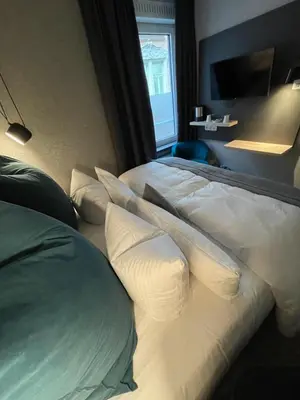 Ein Bett oder Betten in einem Zimmer der Unterkunft Hotel Falkenturm