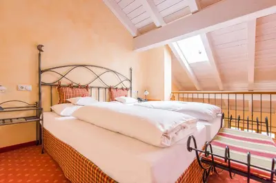 Ein Bett oder Betten in einem Zimmer der Unterkunft Hotel und Landgasthof Altwirt