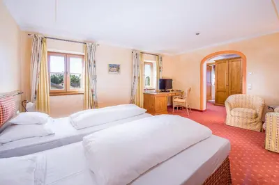 Ein Bett oder Betten in einem Zimmer der Unterkunft Hotel und Landgasthof Altwirt