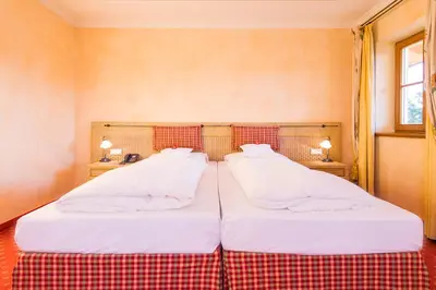 Ein Bett oder Betten in einem Zimmer der Unterkunft Hotel und Landgasthof Altwirt