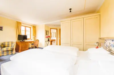 Ein Bett oder Betten in einem Zimmer der Unterkunft Hotel und Landgasthof Altwirt