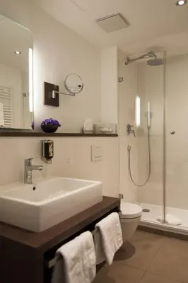 Ein Badezimmer in der Unterkunft Hotel Grünwald