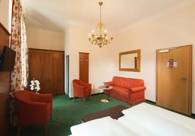 Ein Bett oder Betten in einem Zimmer der Unterkunft Hotel Grünwald