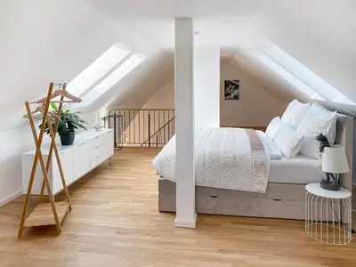 Ein Bett oder Betten in einem Zimmer der Unterkunft Modern & Stylisch - Penthouse-Feeling nahe Flughafen München