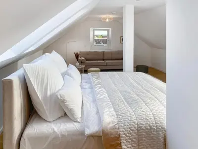 Ein Bett oder Betten in einem Zimmer der Unterkunft Modern & Stylisch - Penthouse-Feeling nahe Flughafen München