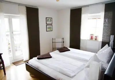 Ein Bett oder Betten in einem Zimmer der Unterkunft Ferienwohnung Riesenblick