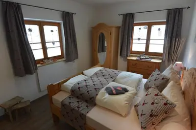 Ein Bett oder Betten in einem Zimmer der Unterkunft Ferienwohnung Viererspitzblick
