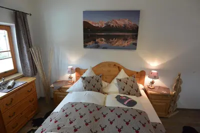 Ein Bett oder Betten in einem Zimmer der Unterkunft Ferienwohnung Viererspitzblick