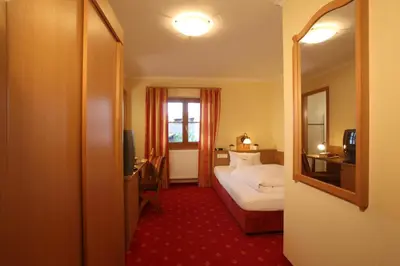 Ein Bett oder Betten in einem Zimmer der Unterkunft Gasthof Mühlwinkl