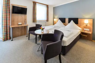 Ein Bett oder Betten in einem Zimmer der Unterkunft Gasthof Mühlwinkl