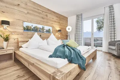 Ein Bett oder Betten in einem Zimmer der Unterkunft Zum Fischer am See ***S