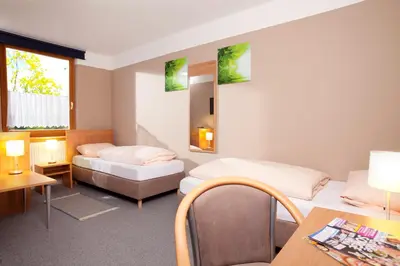 Ein Bett oder Betten in einem Zimmer der Unterkunft Gasthaus Mooshäusl