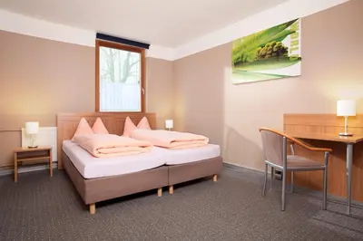 Ein Bett oder Betten in einem Zimmer der Unterkunft Gasthaus Mooshäusl