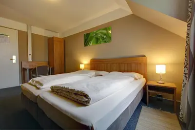 Ein Bett oder Betten in einem Zimmer der Unterkunft Gasthaus Mooshäusl