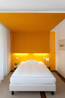 Ein Bett oder Betten in einem Zimmer der Unterkunft Seehotel Leoni