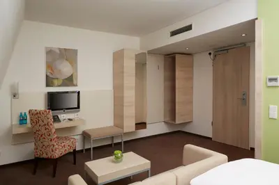 TV/Unterhaltungsangebot in der Unterkunft H+ Hotel München