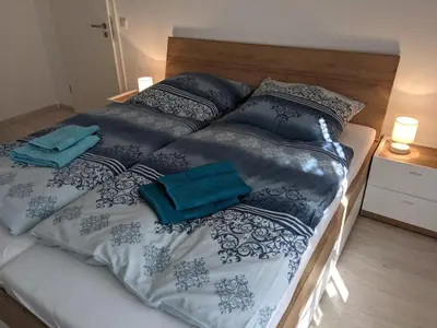 Ein Bett oder Betten in einem Zimmer der Unterkunft Ferienwohnung MonSevi