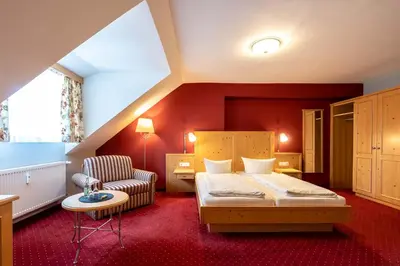 Ein Bett oder Betten in einem Zimmer der Unterkunft Hotel Vollmann