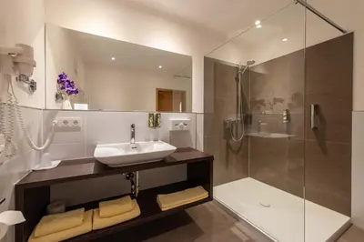 Ein Badezimmer in der Unterkunft Hotel Vollmann
