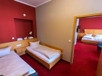 Ein Bett oder Betten in einem Zimmer der Unterkunft Hotel Vollmann