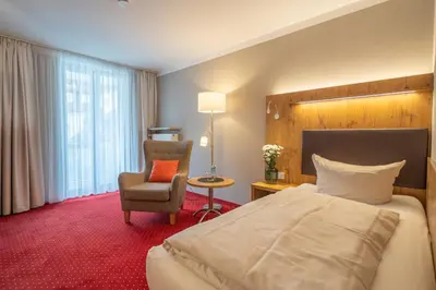 Ein Bett oder Betten in einem Zimmer der Unterkunft Hotel Vollmann