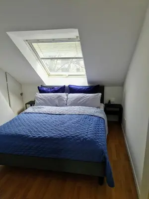 Ein Bett oder Betten in einem Zimmer der Unterkunft Rooftop Solln - 20min Oktoberfest/Zentrum