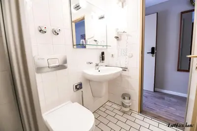 Ein Badezimmer in der Unterkunft Hotel Blutenburg
