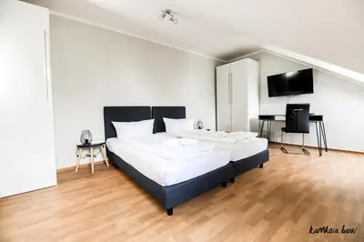 Ein Bett oder Betten in einem Zimmer der Unterkunft Hotel Blutenburg