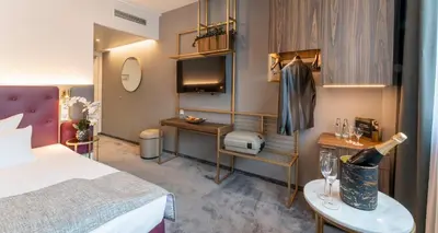 Ein Bett oder Betten in einem Zimmer der Unterkunft PLAZA Premium München