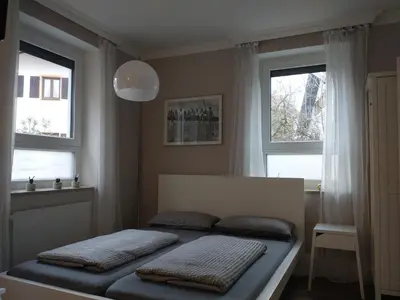Ein Bett oder Betten in einem Zimmer der Unterkunft Bad Aibling City Apartment EG