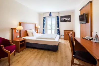 Ein Bett oder Betten in einem Zimmer der Unterkunft Hotel Meridian ***superior