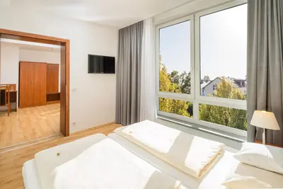 Ein Bett oder Betten in einem Zimmer der Unterkunft Hotel Meridian ***superior