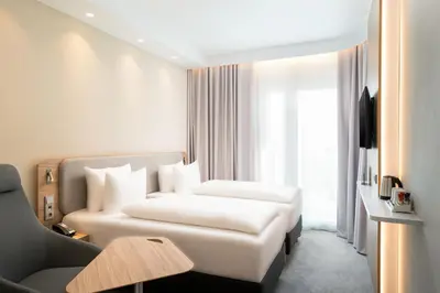 Ein Bett oder Betten in einem Zimmer der Unterkunft Holiday Inn Express - Rosenheim by IHG