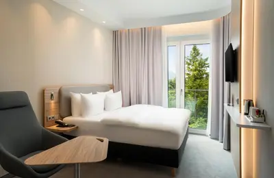 Ein Bett oder Betten in einem Zimmer der Unterkunft Holiday Inn Express - Rosenheim by IHG