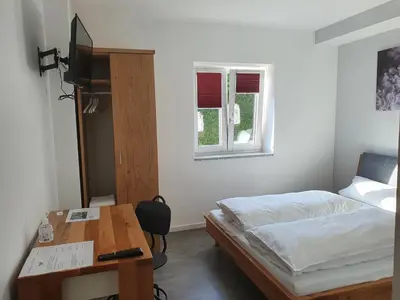 Ein Bett oder Betten in einem Zimmer der Unterkunft Pension HopfaHeisl