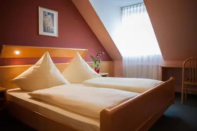 Ein Bett oder Betten in einem Zimmer der Unterkunft Landgasthof Linden